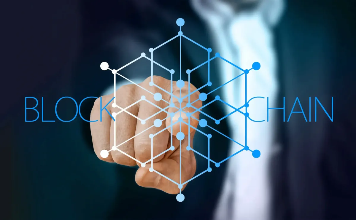 Interlinked glowing blocks forming a chain across a dark field — connected ledger and network nodes, evoking the common, machine-readable API surface corporate banking rails still lack in the agentic era
